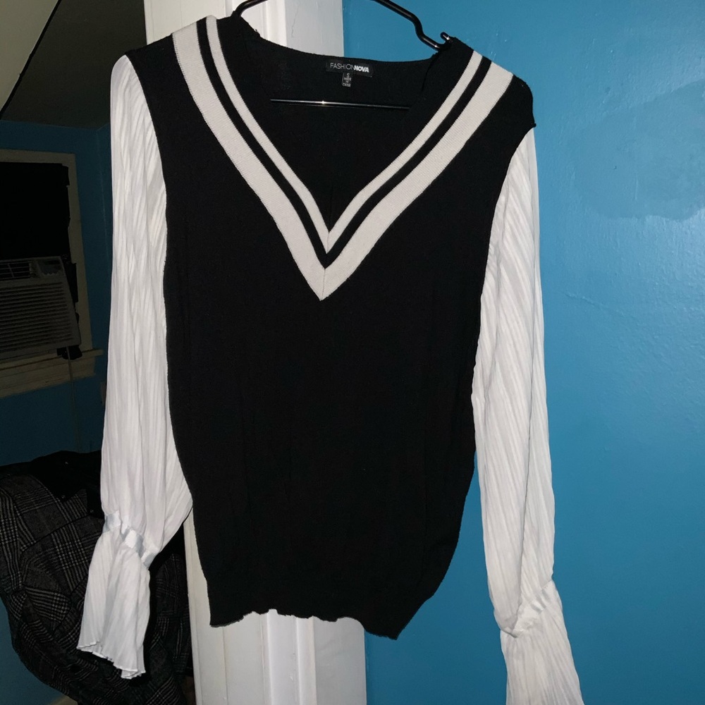 Classic black and white sweater with puffy arms